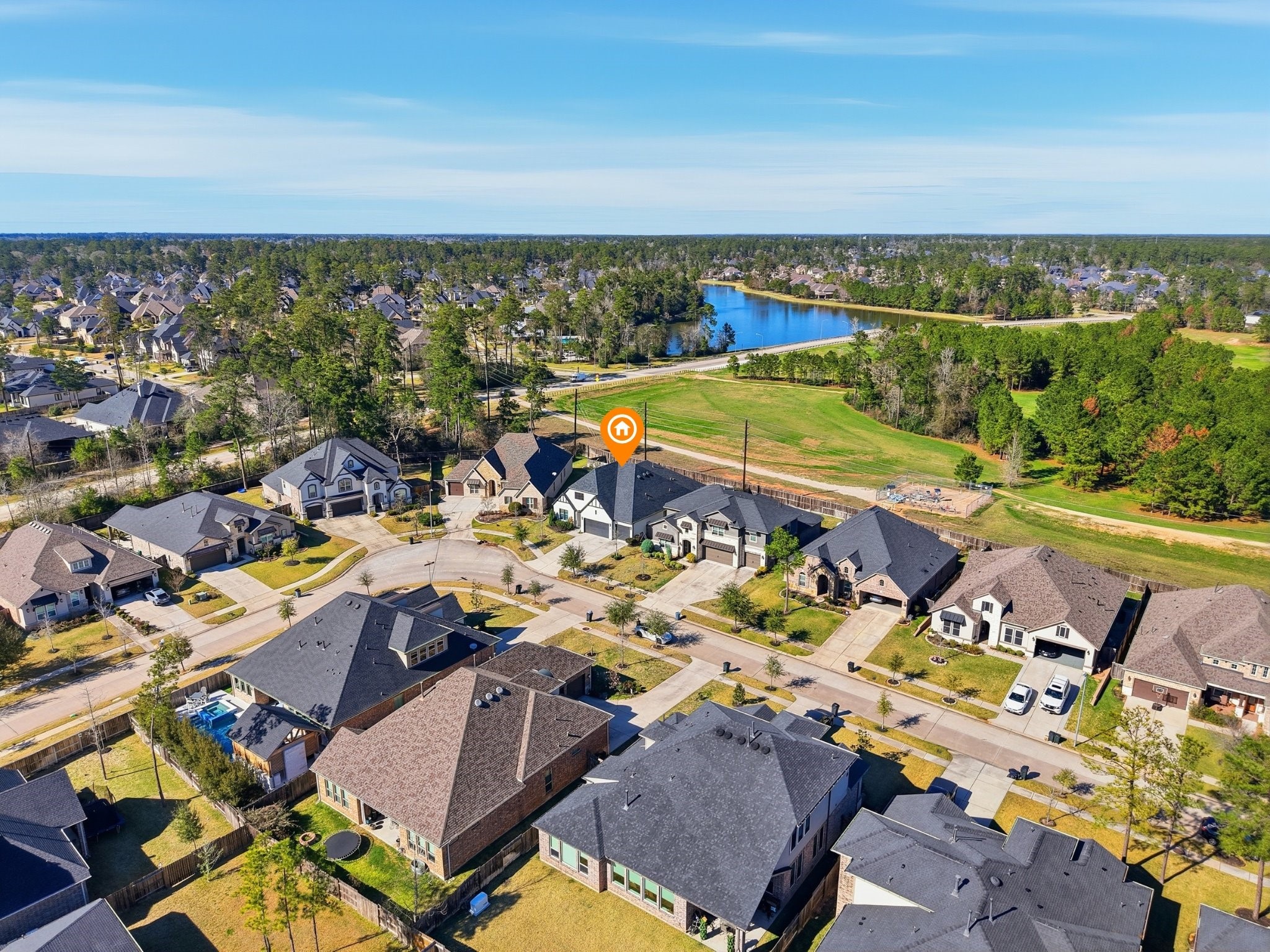 605 Ashbrook Ridge Lane Pinehurst, TX 77362 - Photo 3 of 46 Set in the vibrant community of Woodtrace, you’ll enjoy a 23-acre lake, clubhouse and pool, scenic walking trails, a 22-acre central park, multiple playgrounds, and gathering spaces that make it easy to feel connected.