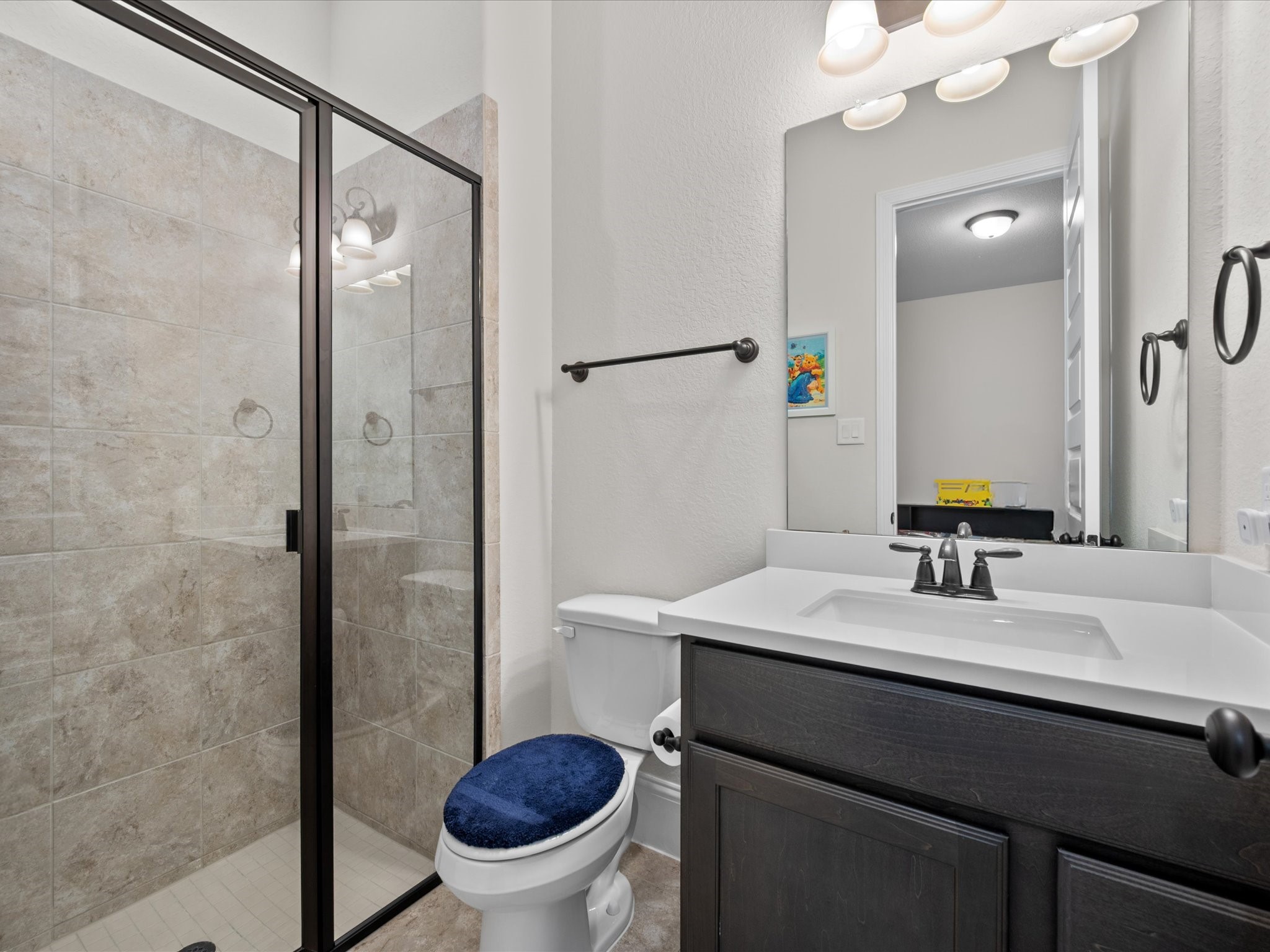 605 Ashbrook Ridge Lane Pinehurst, TX 77362 - Photo 32 of 46 The third full bath offers a spacious shower and direct access from the en-suite bedroom.