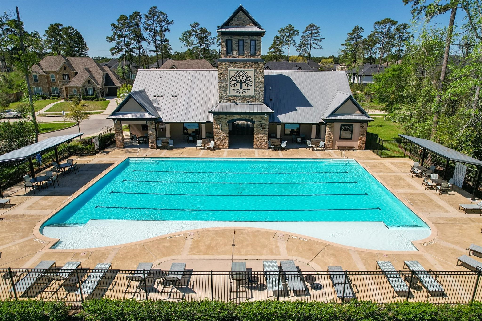 605 Ashbrook Ridge Lane Pinehurst, TX 77362 - Photo 41 of 46 Residents enjoy access to a beautiful community clubhouse and resort-style pool.