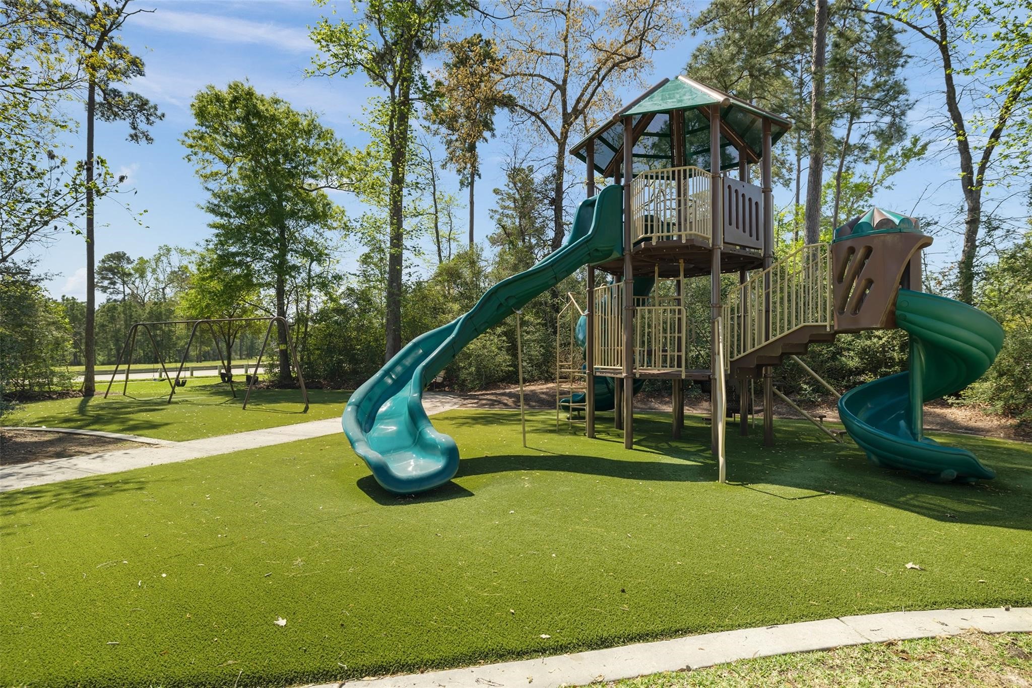605 Ashbrook Ridge Lane Pinehurst, TX 77362 - Photo 42 of 46 Multiple playgrounds and parks create inviting spaces for outdoor fun and connection.