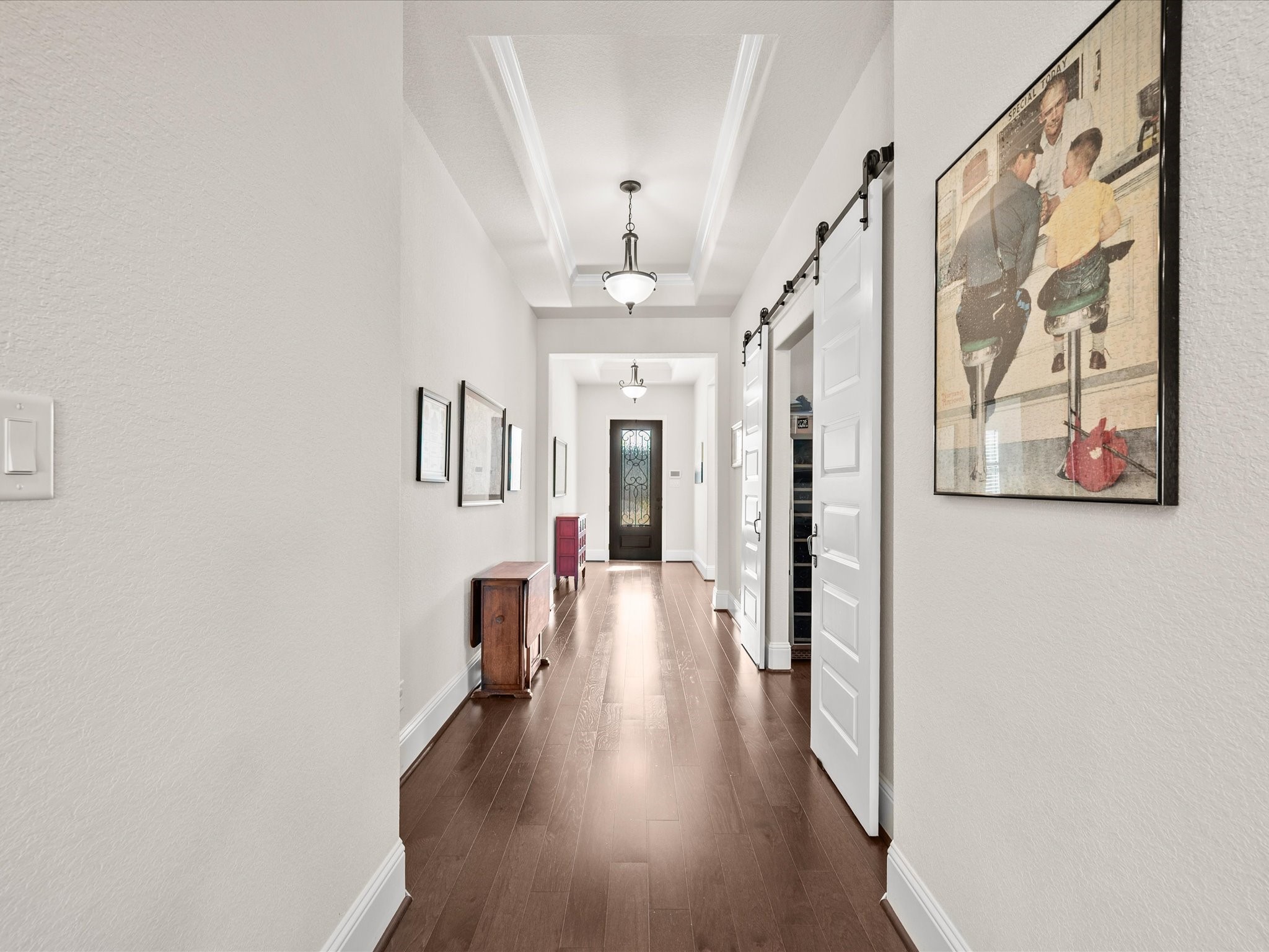 605 Ashbrook Ridge Lane Pinehurst, TX 77362 - Photo 10 of 46 The home office is anchored by charming farmhouse doors, creating a private and stylish space to focus.