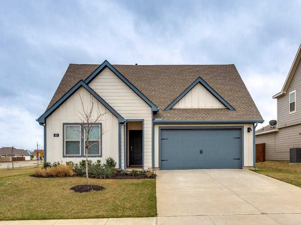 a front view of a house with yard