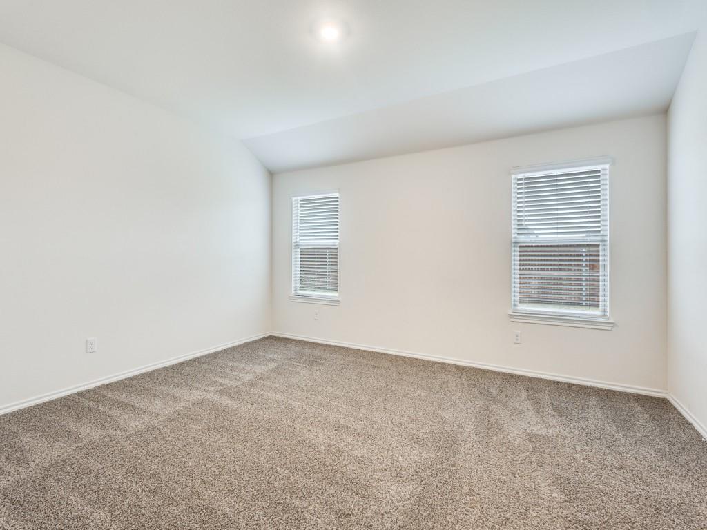 829 Primrose Lane Pilot Point, TX 76258 - Photo 25 of 37 an empty room with windows