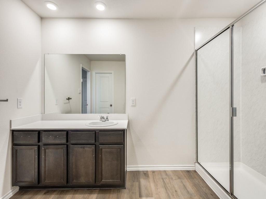 829 Primrose Lane Pilot Point, TX 76258 - Photo 26 of 37 a bathroom with a sink and a mirror