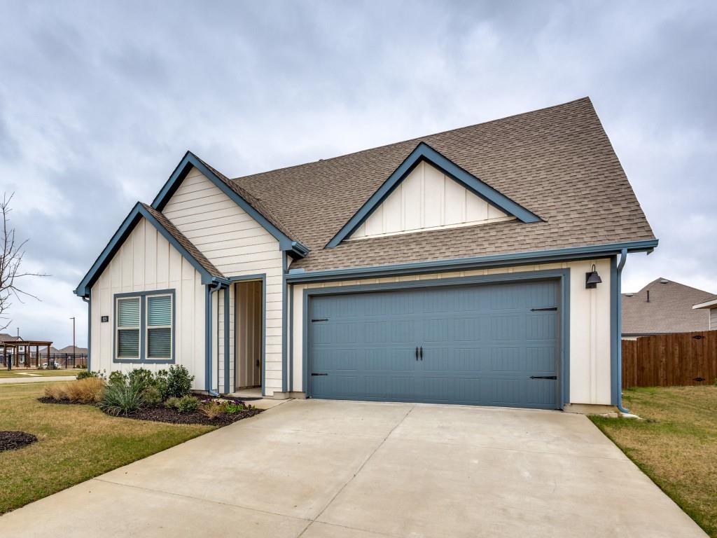 829 Primrose Lane Pilot Point, TX 76258 - Photo 3 of 37 a front view of a house with a yard and garage