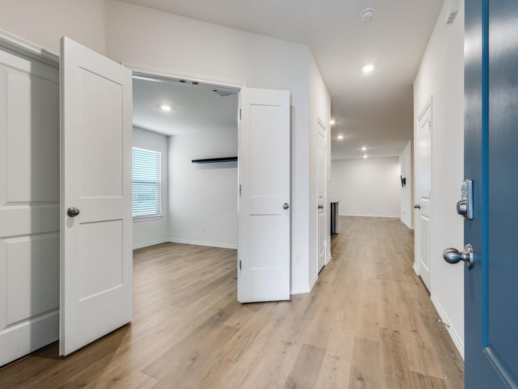 829 Primrose Lane Pilot Point, TX 76258 - Photo 5 of 37 a view of a hallway with wooden floor