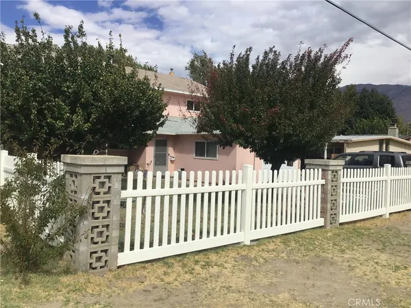 a view of a house with a fence