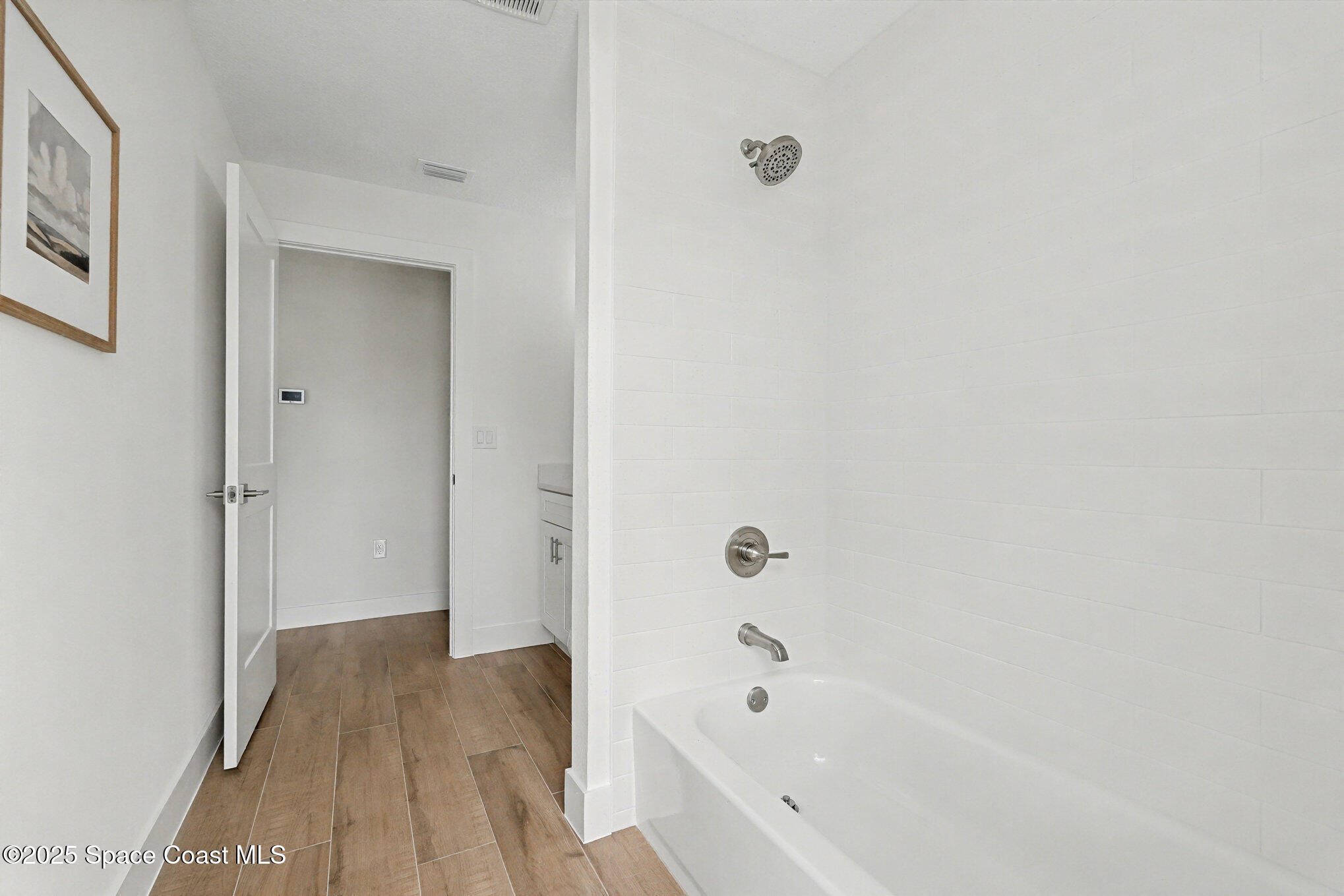 6003 Gilson Avenue Cocoa, FL 32927 - Photo 22 of 27 a bathroom with a bathtub and a shower