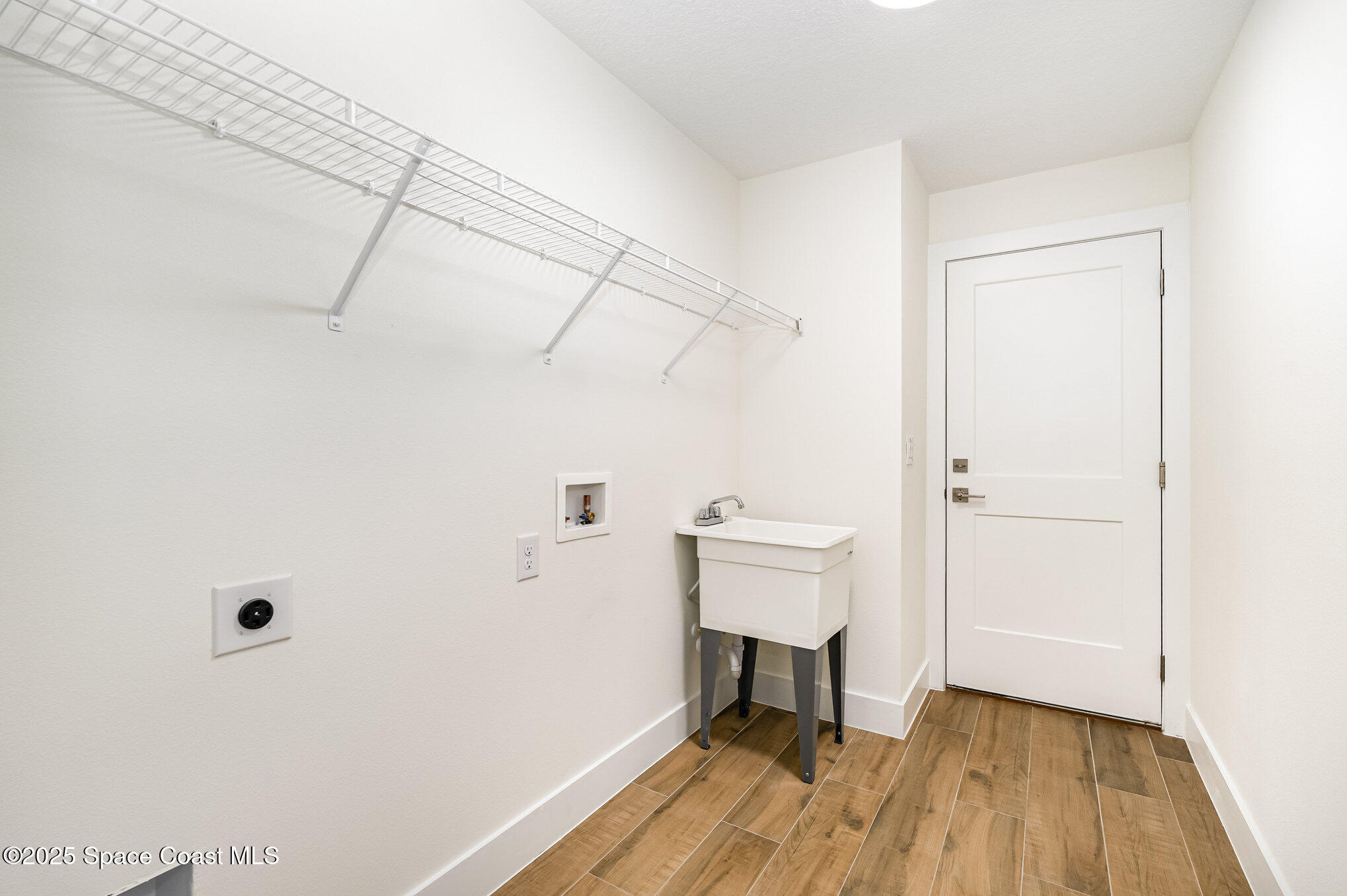 6003 Gilson Avenue Cocoa, FL 32927 - Photo 24 of 27 a view of small space with racks on the wall