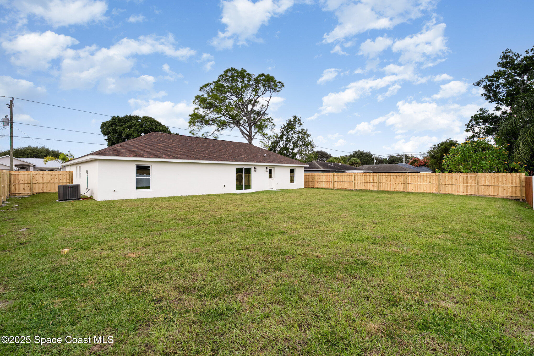 6003 Gilson Avenue Cocoa, FL 32927 - Photo 27 of 27 a front view of a house with garden