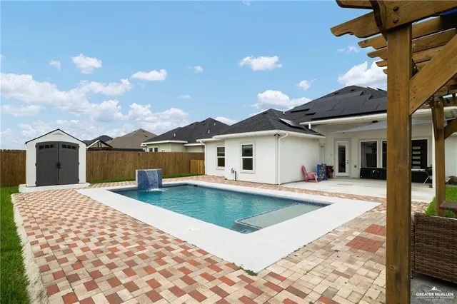 a front view of a house with yard patio and balcony