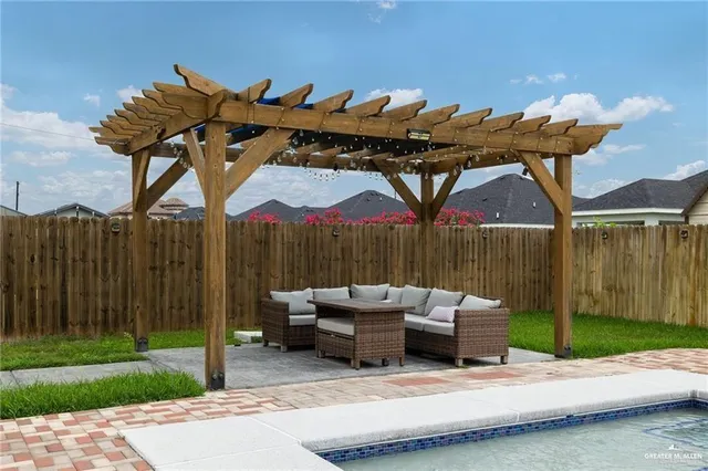 a backyard of a house with table and chairs