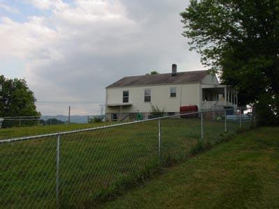 1437 Gun Club Road Northwest Roanoke, VA 24017 - Photo 2 of 16 a front view of a house with garden
