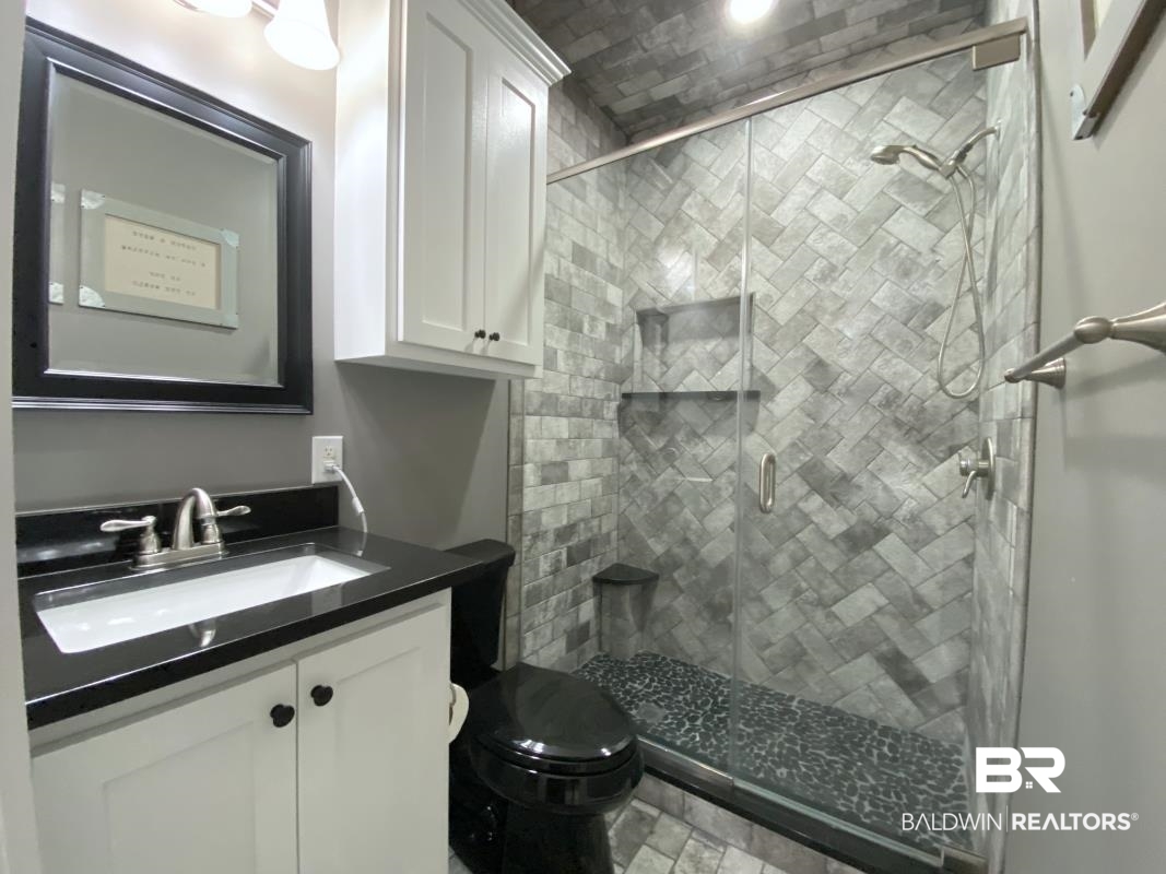 28888 Canal Road, Unit 33 Orange Beach, AL 36561 - Photo 7 of 23 Full bath with vanity and a shower stall