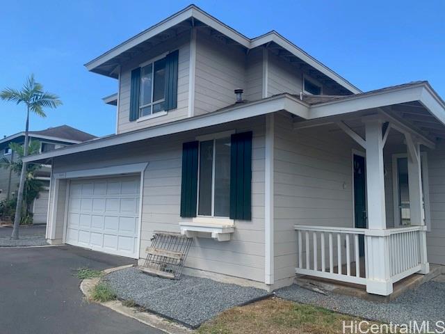 91-211 Kakuhihewa Place, Unit F Kapolei, HI 96707 - Photo 1 of 25 a front view of a house with garage