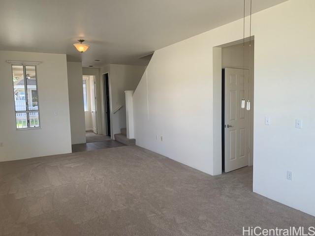 91-211 Kakuhihewa Place, Unit F Kapolei, HI 96707 - Photo 18 of 25 an empty room with windows and closet