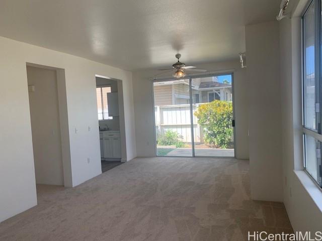 91-211 Kakuhihewa Place, Unit F Kapolei, HI 96707 - Photo 19 of 25 an empty room with windows and outdoor view