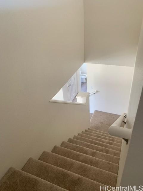 91-211 Kakuhihewa Place, Unit F Kapolei, HI 96707 - Photo 20 of 25 a bedroom with a bed and a window