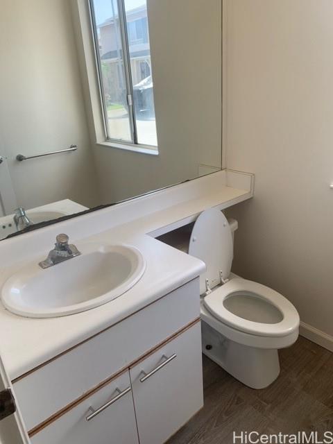 91-211 Kakuhihewa Place, Unit F Kapolei, HI 96707 - Photo 25 of 25 a bathroom with a sink and a toilet