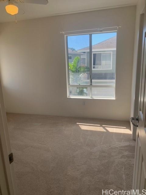 91-211 Kakuhihewa Place, Unit F Kapolei, HI 96707 - Photo 5 of 25 a view of an empty room with a window