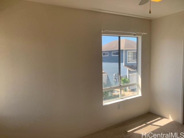 91-211 Kakuhihewa Place, Unit F Kapolei, HI 96707 - Photo 9 of 25 an empty room with windows