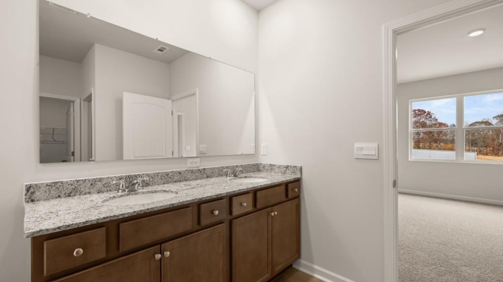 103 Babcock Drive Northeast Rome, GA 30165 - Photo 18 of 33 a bathroom with a granite countertop sink and a mirror