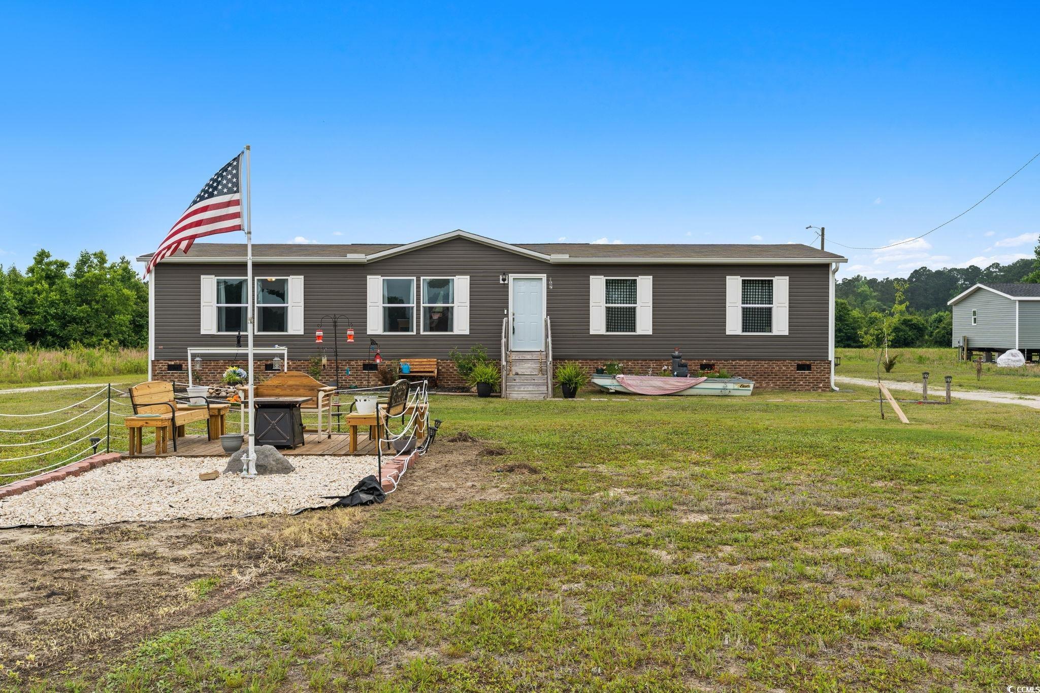 167 Dove Road Loris, SC 29569 - Photo 1 of 40 Back of house with crawl space, a yard, and entry