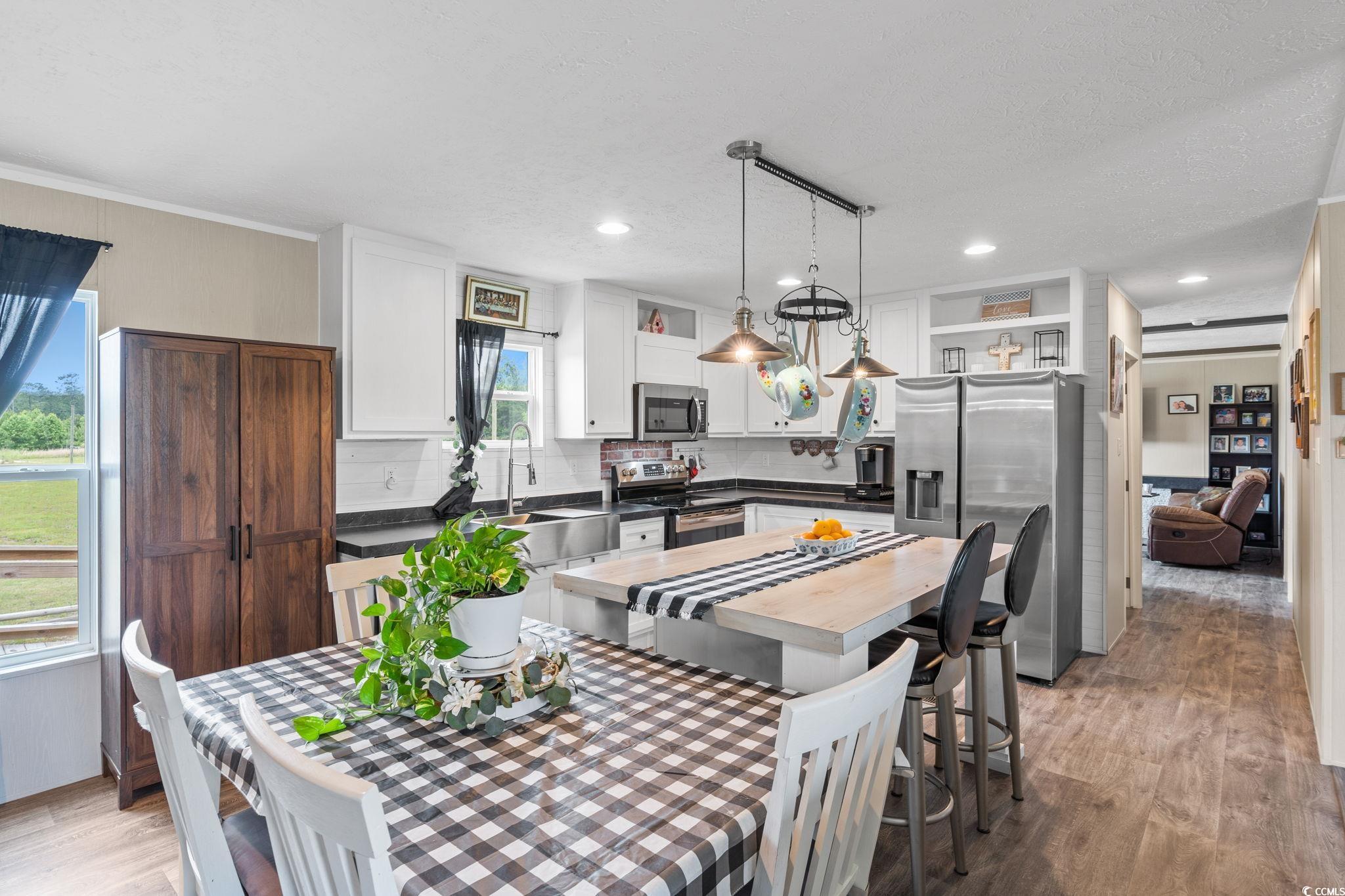 167 Dove Road Loris, SC 29569 - Photo 11 of 40 Dining area with light wood-style floors, recessed