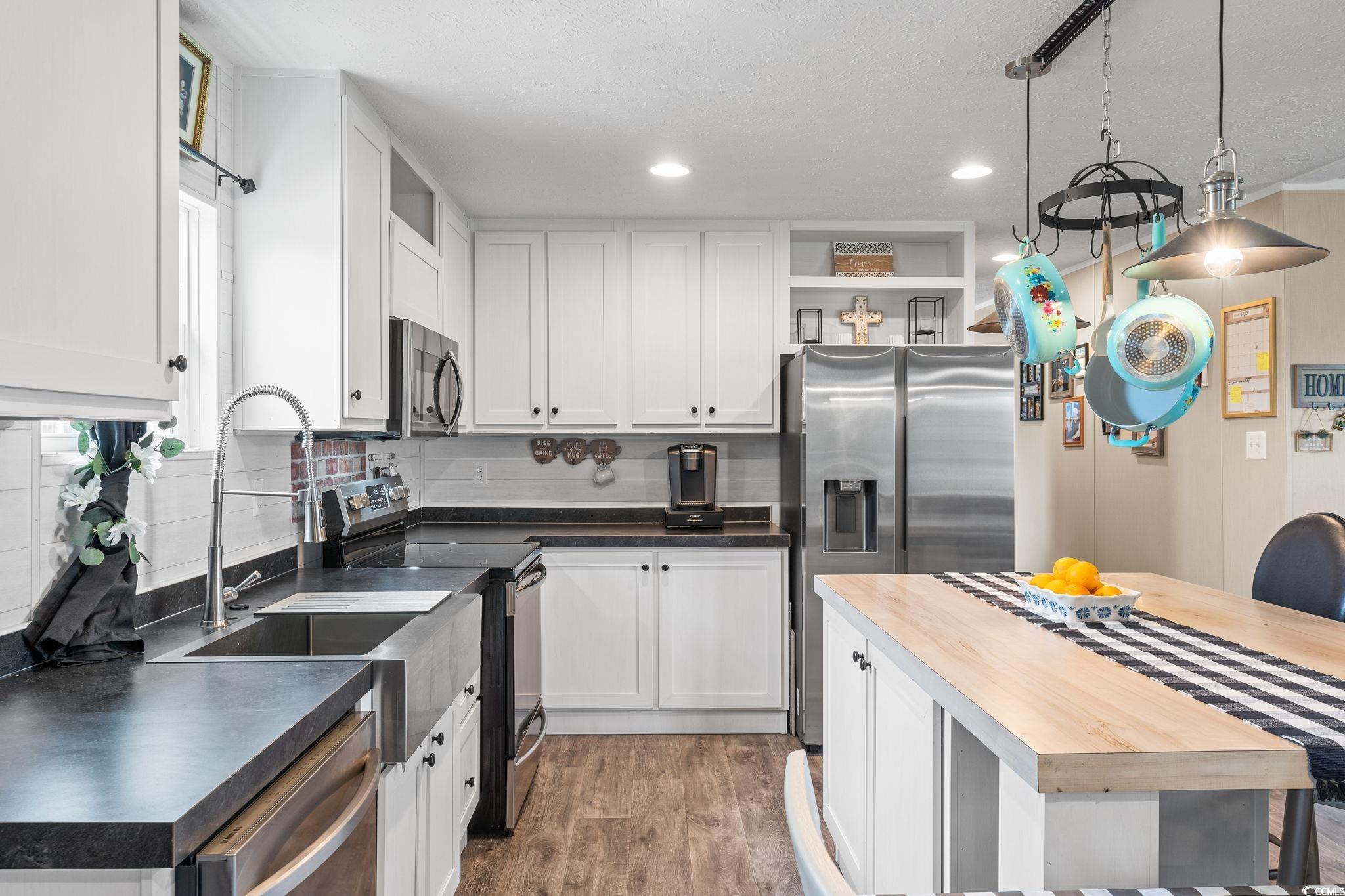 167 Dove Road Loris, SC 29569 - Photo 12 of 40 Kitchen with stainless steel appliances, open shel
