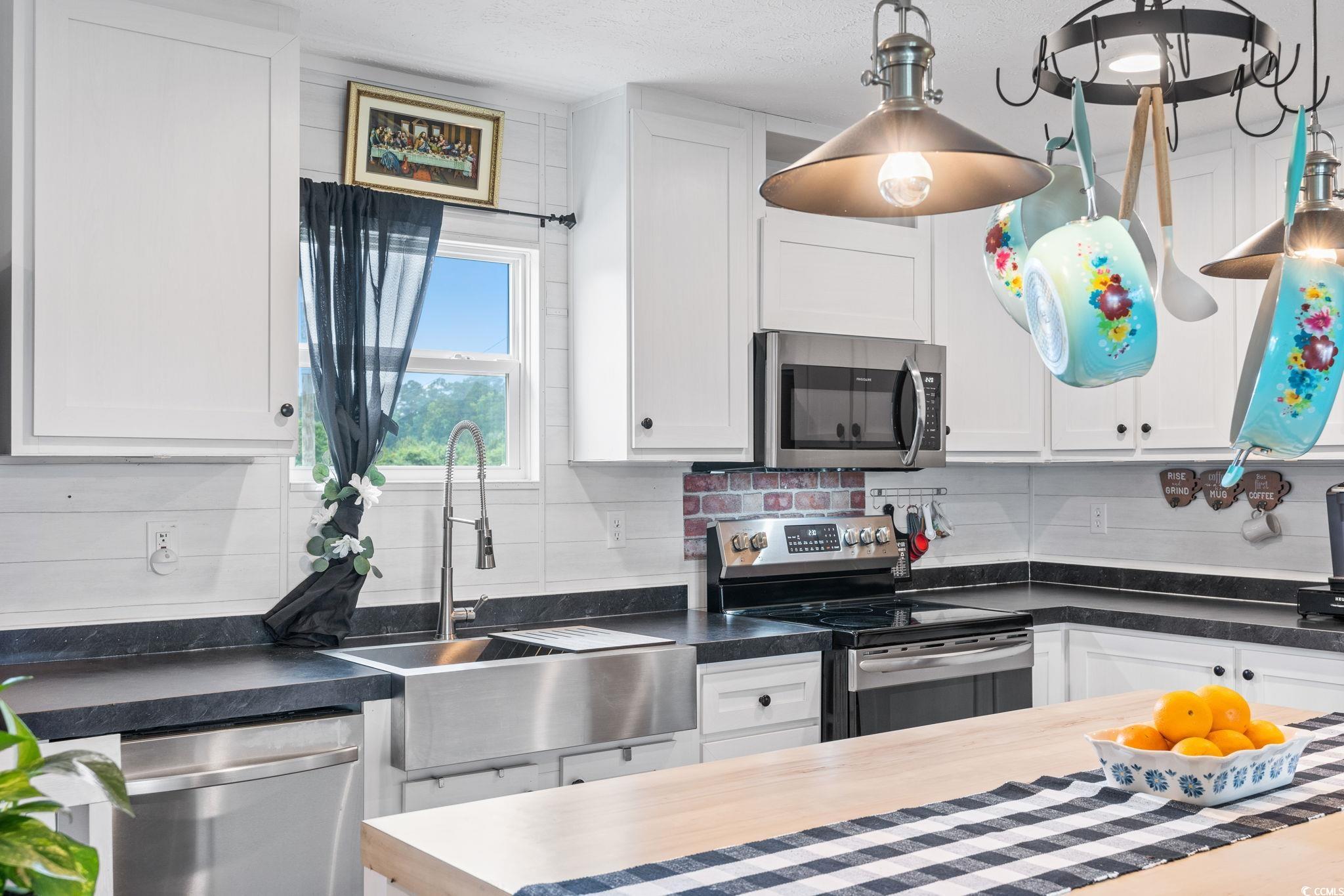 167 Dove Road Loris, SC 29569 - Photo 13 of 40 Kitchen with appliances with stainless steel finis
