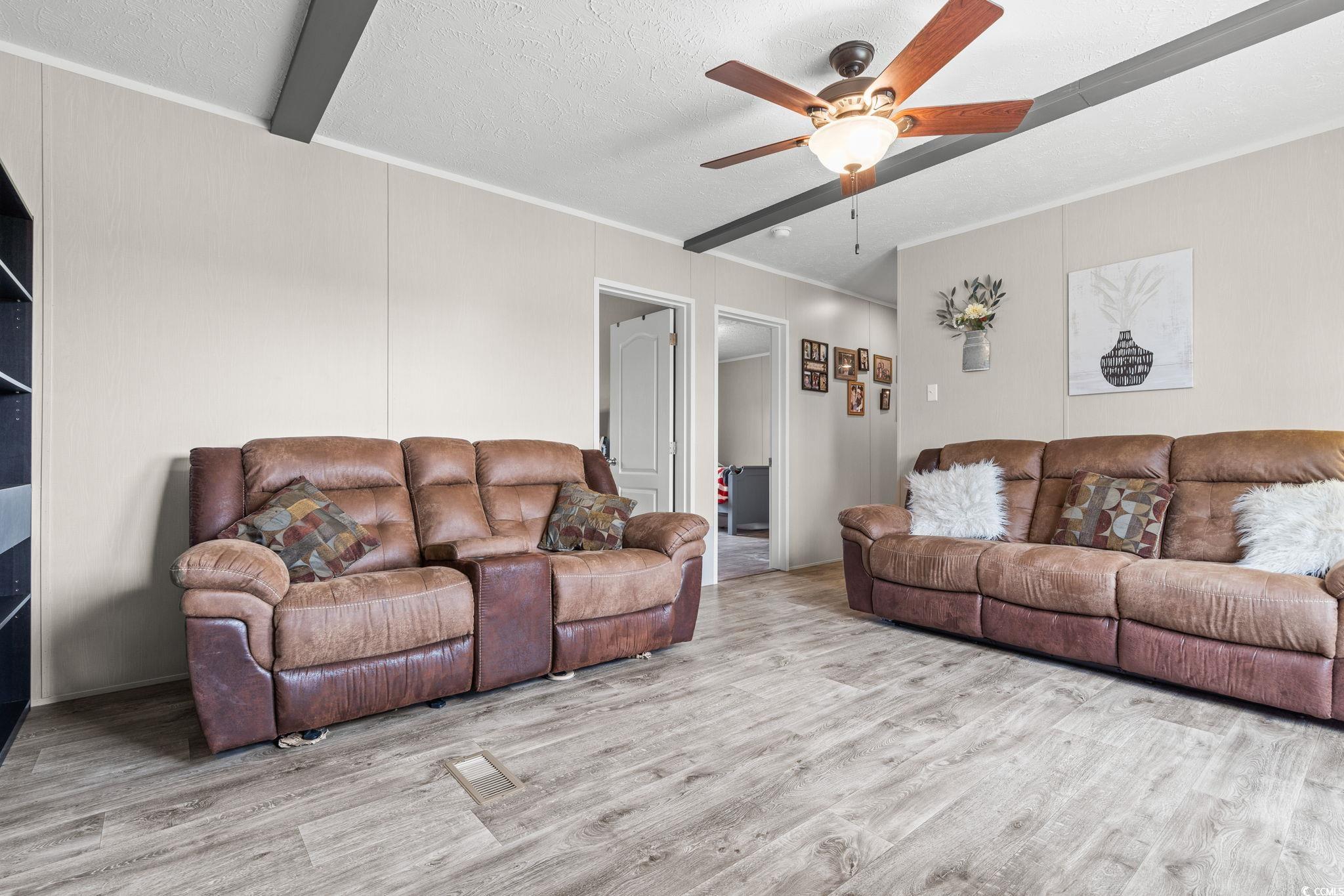 167 Dove Road Loris, SC 29569 - Photo 23 of 40 Living area featuring wood finished floors, a ceil