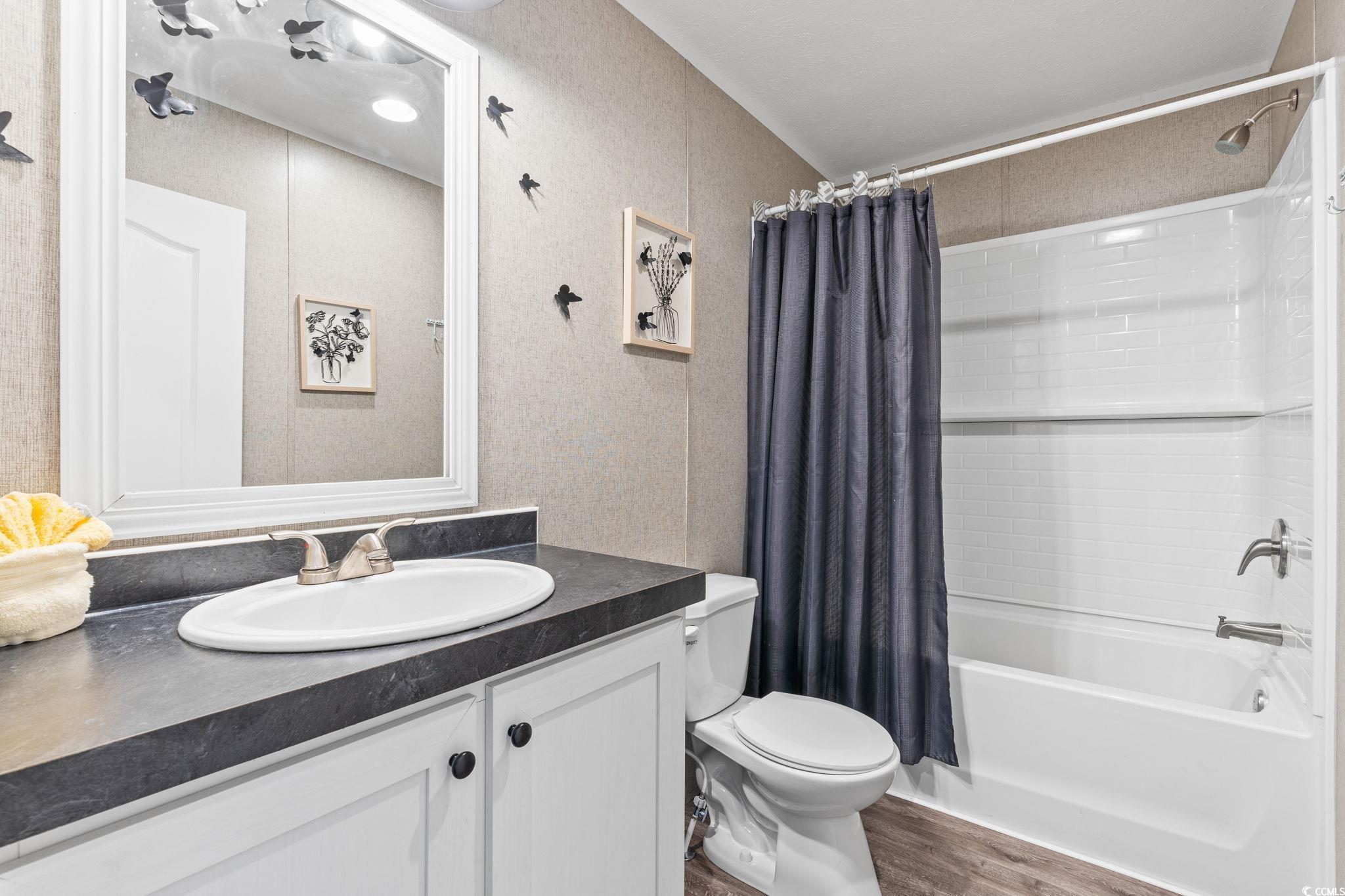 167 Dove Road Loris, SC 29569 - Photo 24 of 40 Bathroom with vanity, shower / bath combo with sho