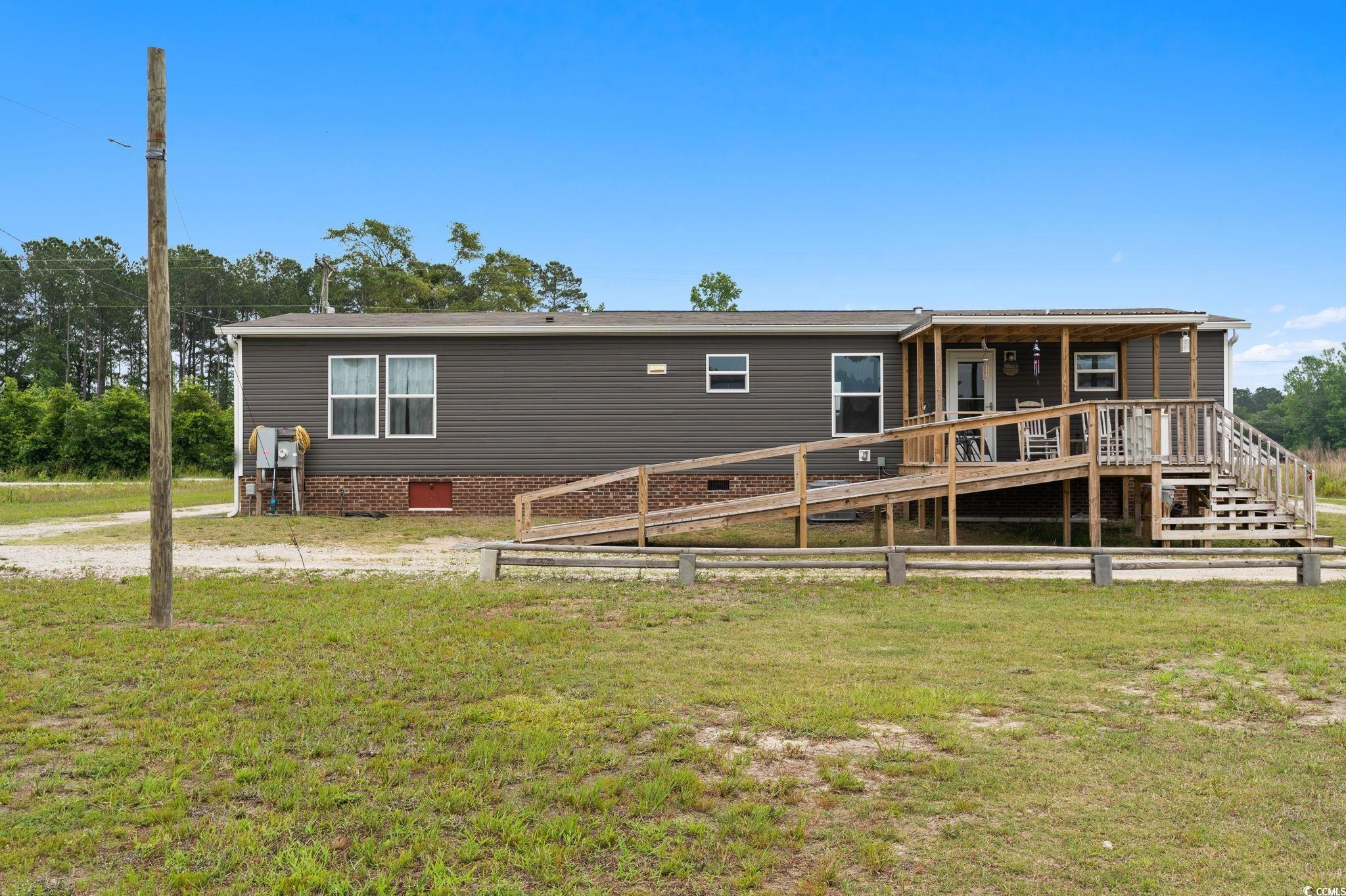 167 Dove Road Loris, SC 29569 - Photo 3 of 40 Rear view of house featuring a yard, crawl space,