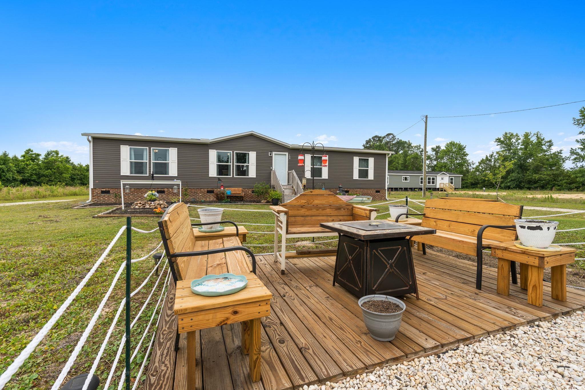 167 Dove Road Loris, SC 29569 - Photo 4 of 40 Wooden deck with a lawn