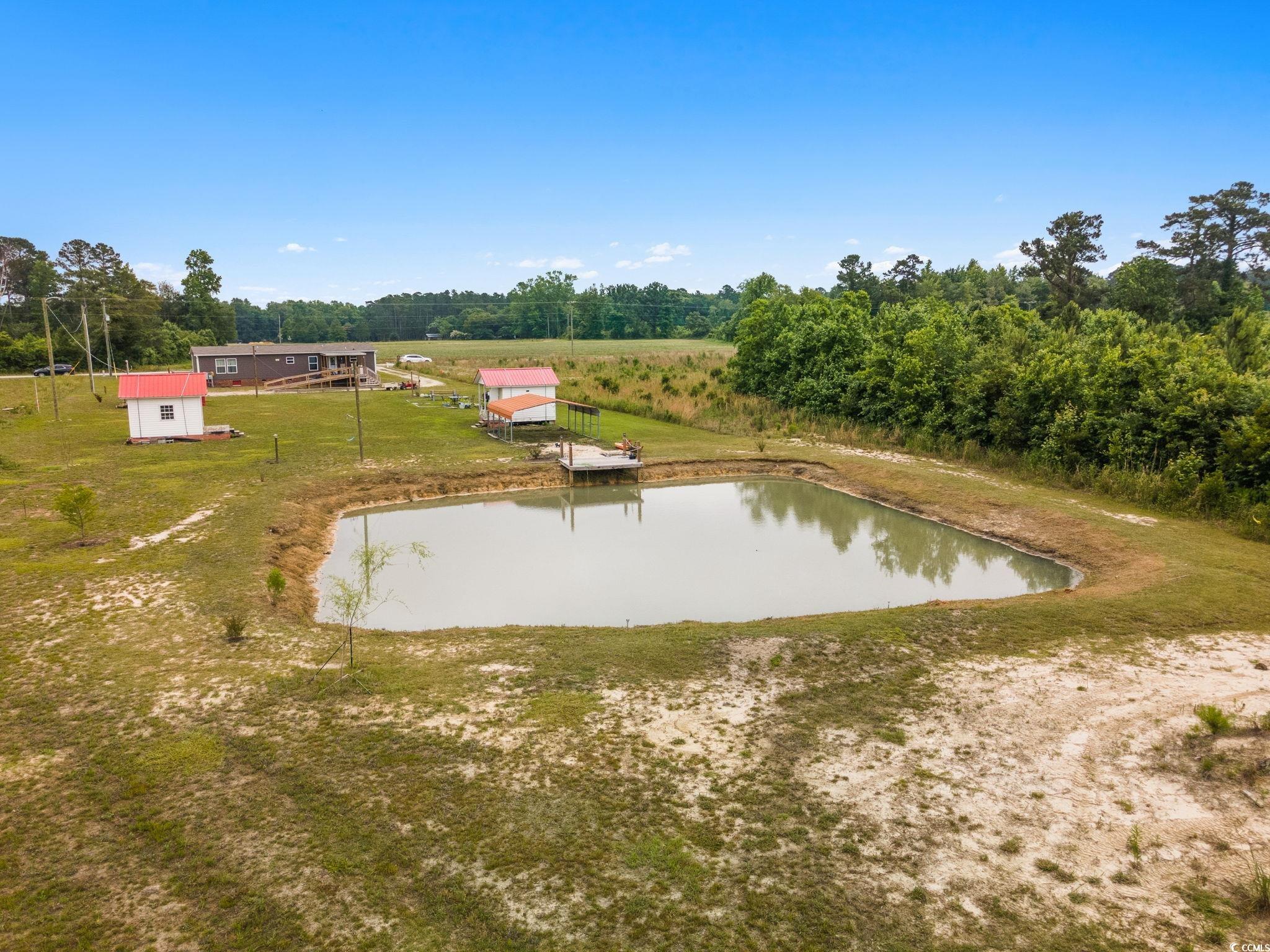 167 Dove Road Loris, SC 29569 - Photo 6 of 40 View of storm shelter featuring a water view and a