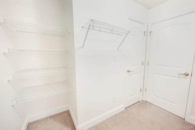a view of an empty walk in closet