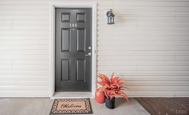 a bench sitting in front of a door