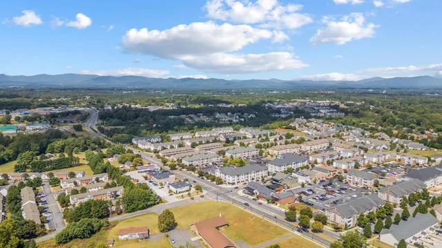 a view of a lake with houses in the back