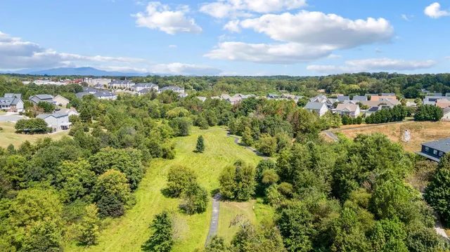 an aerial view of a house with a garden