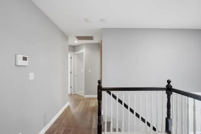 a view of a hallway view with staircase