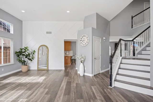 a view of entryway with livingroom and wooden floor