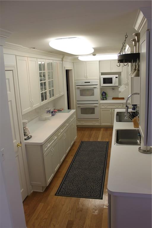221 Two Mile Run Road Ligonier, PA 15658 - Photo 16 of 44 a kitchen with refrigerator cabinets and wooden floor