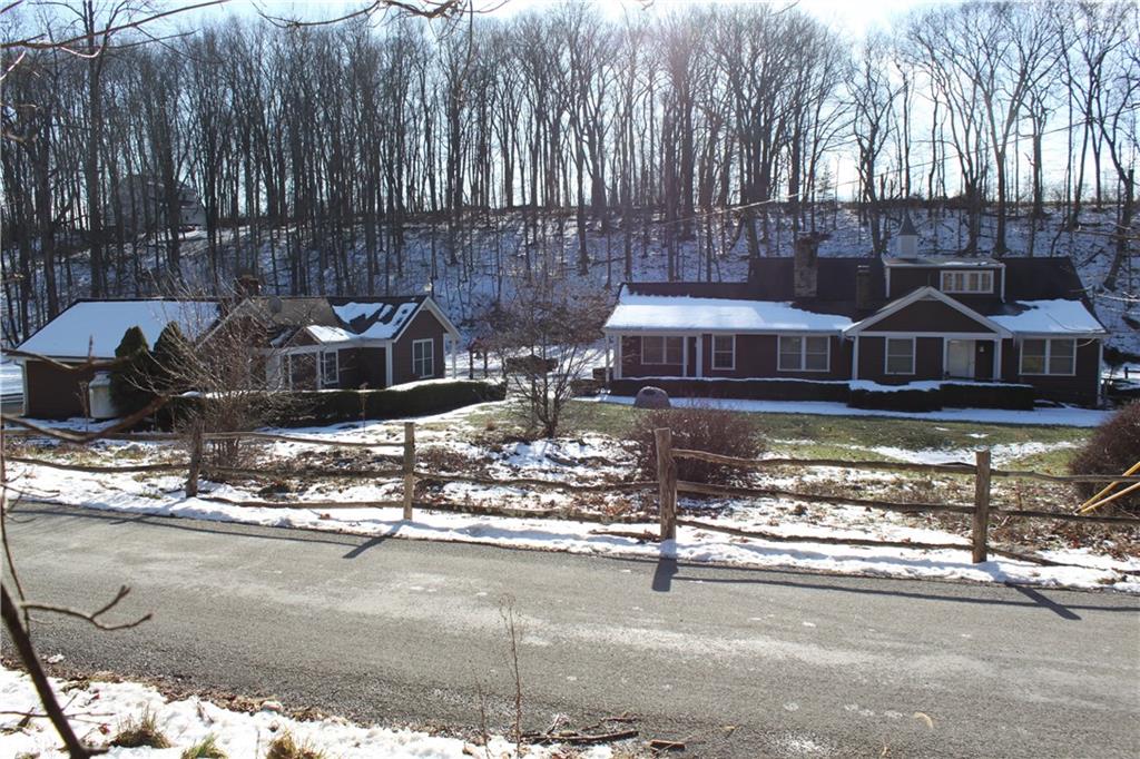 221 Two Mile Run Road Ligonier, PA 15658 - Photo 2 of 44 a view of a house with backyard and sitting area