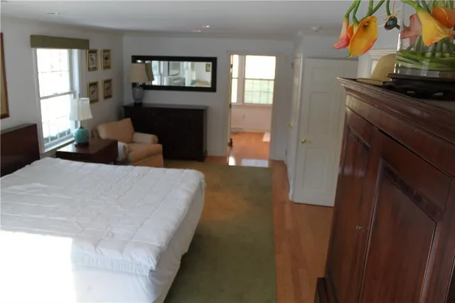 a bed room with a bed and fireplace