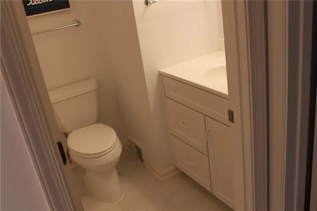 a bathroom with a sink and toilet