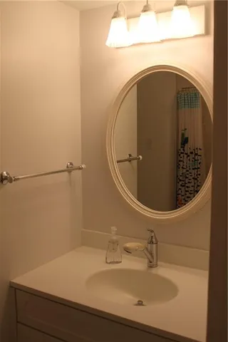 a bathroom with a sink and mirror