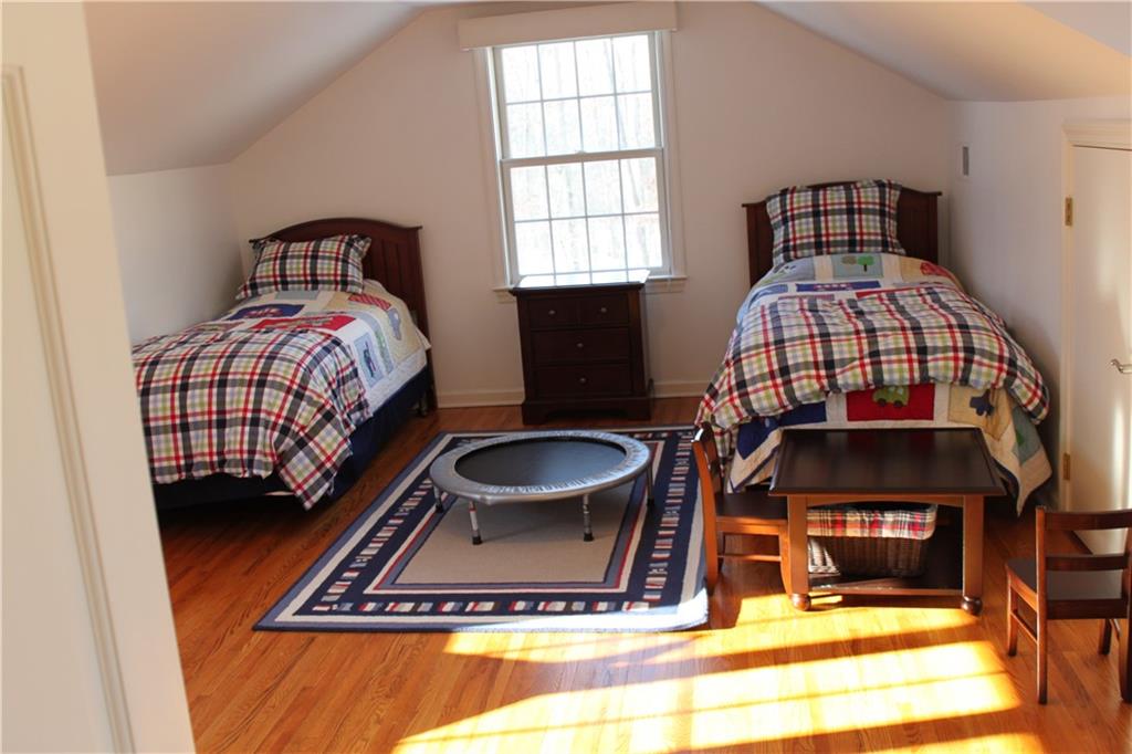 221 Two Mile Run Road Ligonier, PA 15658 - Photo 33 of 44 a living room with a bed furniture a rug and a window