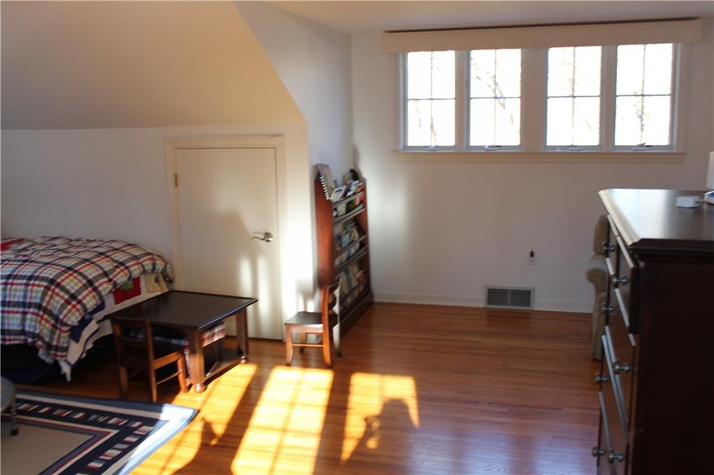 221 Two Mile Run Road Ligonier, PA 15658 - Photo 34 of 44 a bedroom with a bed and wooden floor