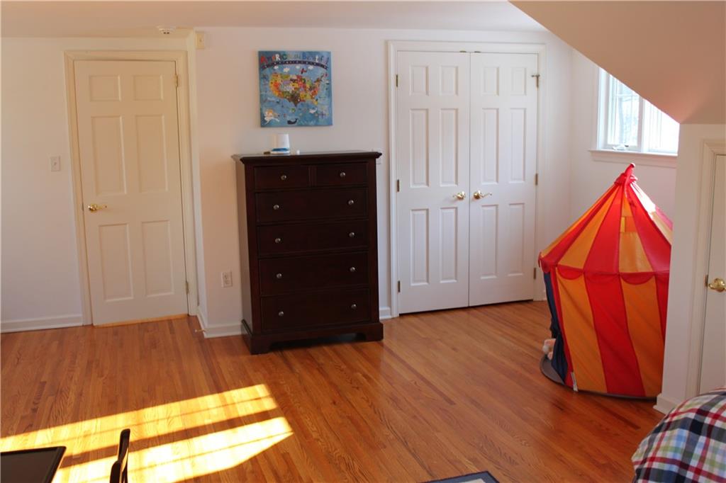 221 Two Mile Run Road Ligonier, PA 15658 - Photo 35 of 44 a view of a bedroom with wooden floor and closet
