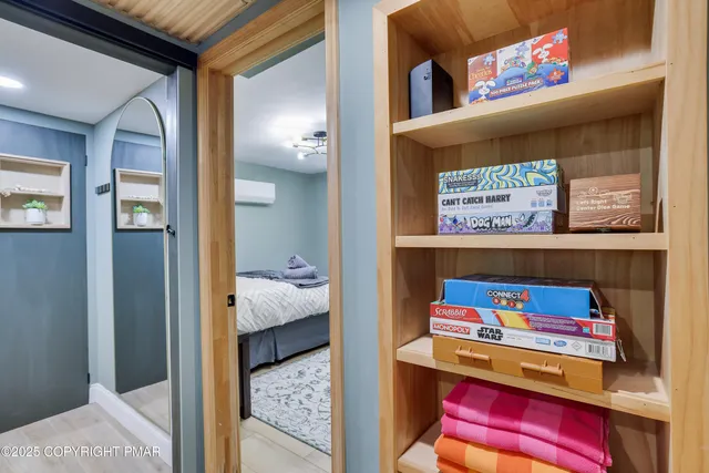 a view of room with furniture and baby bed